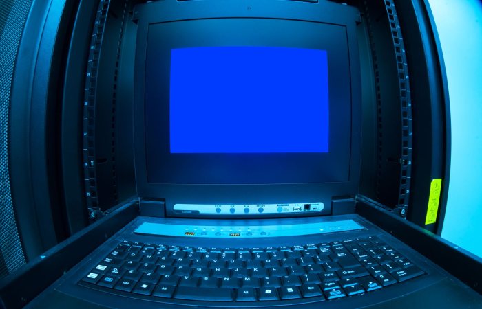 Close-up of a blue screen error shown on a data center control terminal.