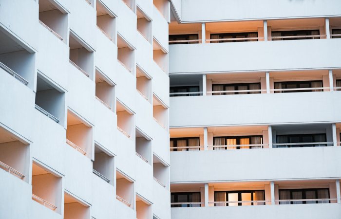 Elegant hotel facade showcasing modern architecture in Bali, Indonesia at dusk.